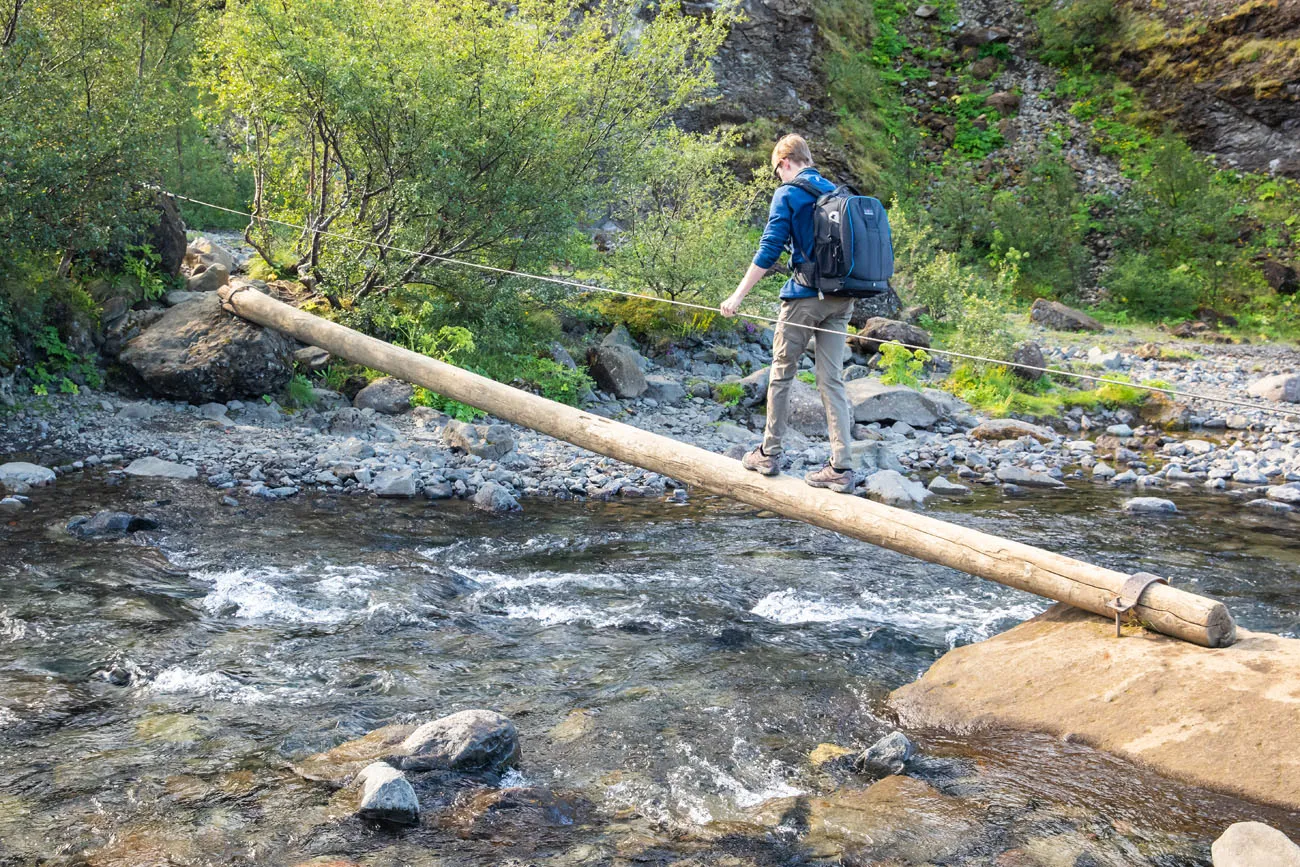 Log Crossing Glymur Waterfall