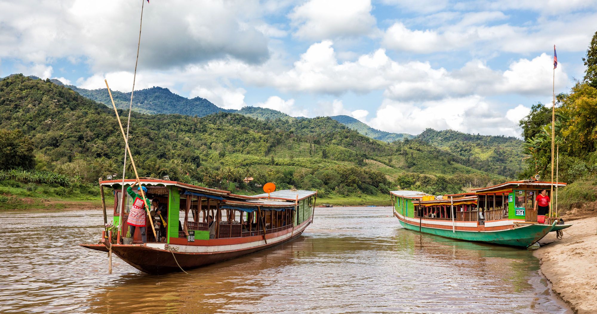 https://www.earthtrekkers.com/wp-content/uploads/2020/05/Mekong-River-Laos-Slow-Boat.jpg.optimal.jpg