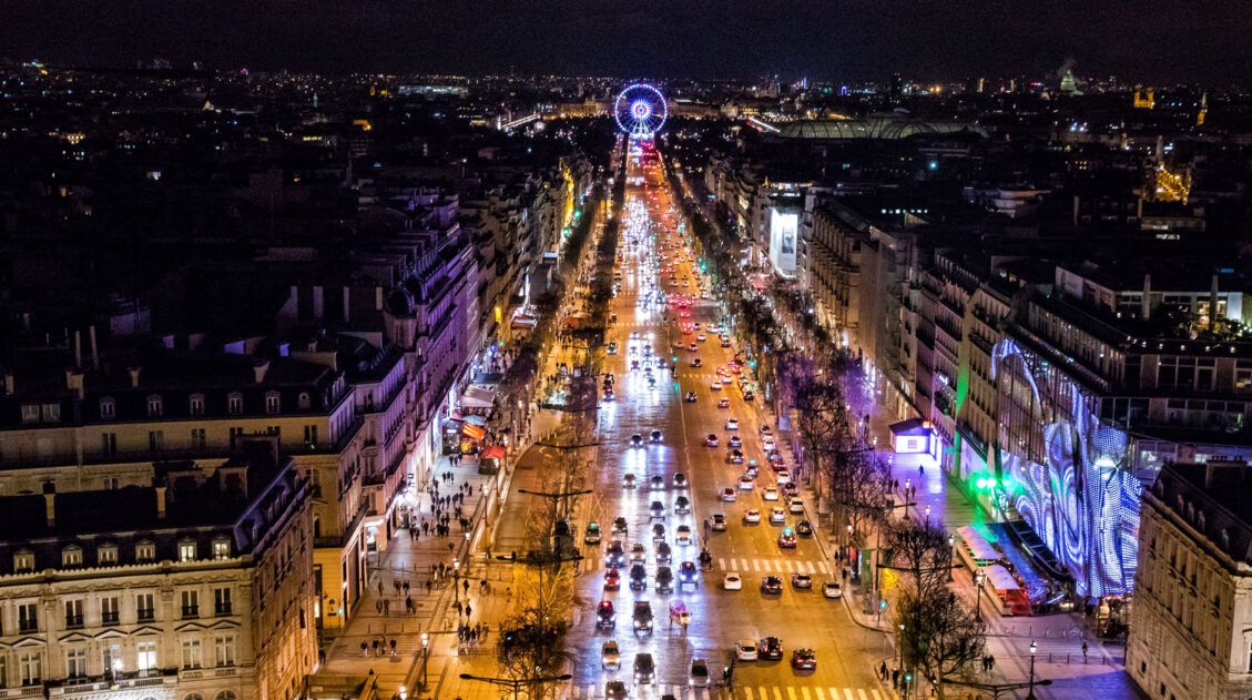 Looking down the Champs-Elysees at night from the top of the Arc de Triomphe.